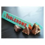 Швейцарський молочний шоколад Tobleron з медом, мигдалевою нугою і солоним карамельним мигдалем 100 г