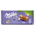 Шоколад молочний із лісовим горіхом Milka Hazelnuts Швейцарія 100 г