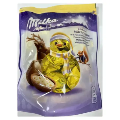 Шоколадні цукерки з кремом і лісовим горіхом Milka Bonbons Milchcreme 86 р Швейцарія