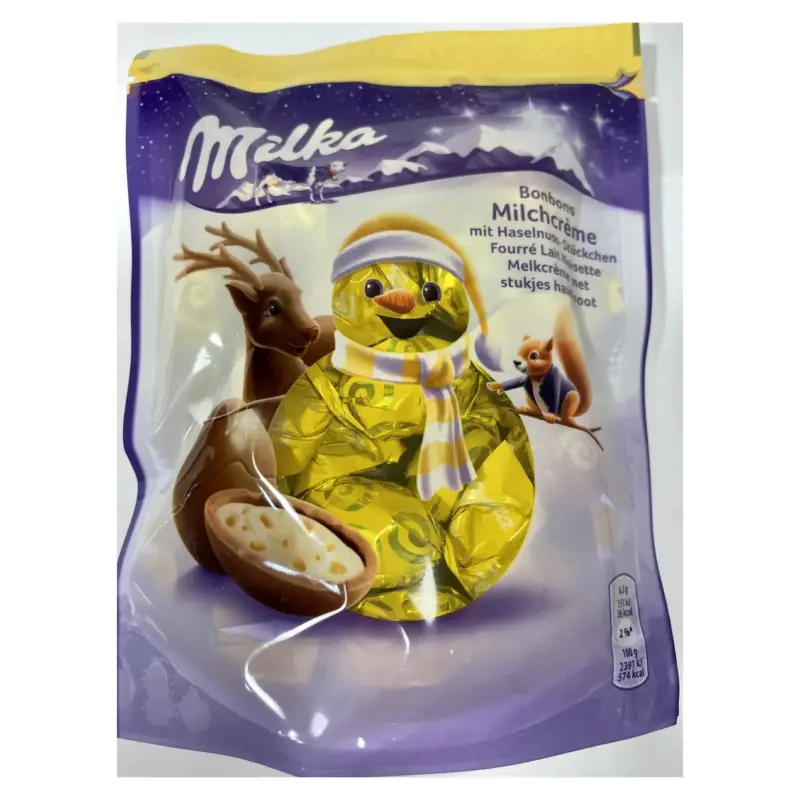 Шоколадні цукерки з кремом і лісовим горіхом Milka Bonbons Milchcreme 86 р Швейцарія