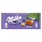 Шоколад молочний із лісовим горіхом Milka Hazelnuts Швейцарія 100 г