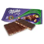 Шоколад молочний із лісовим горіхом Milka Hazelnuts Швейцарія 100 г